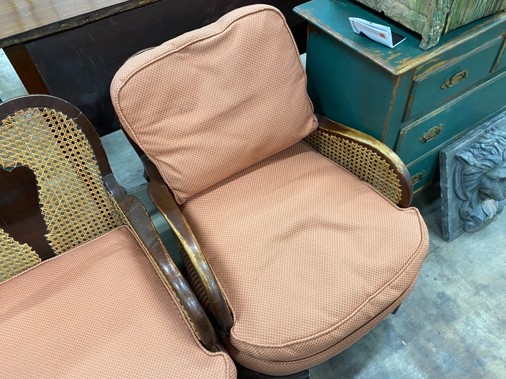 A 1920's caned beech two piece bergere suite, settee length 168cm, depth 72cm, height 82cm